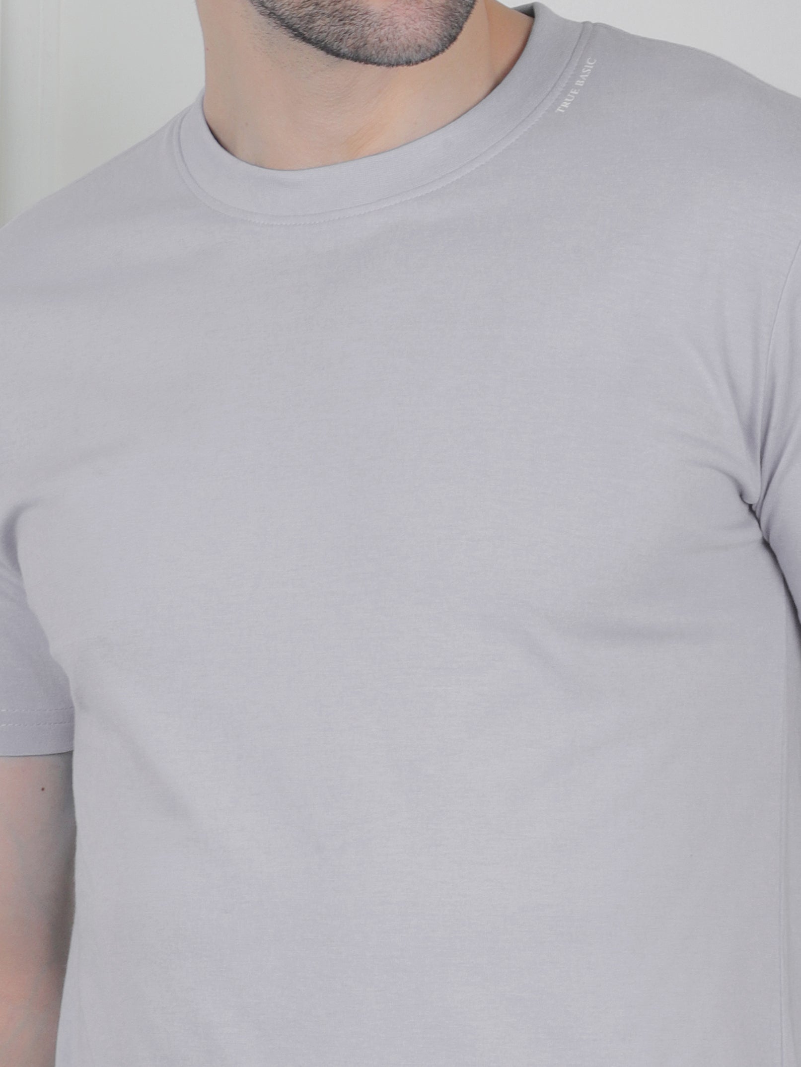 man wearing a grey everyday basic tshirt