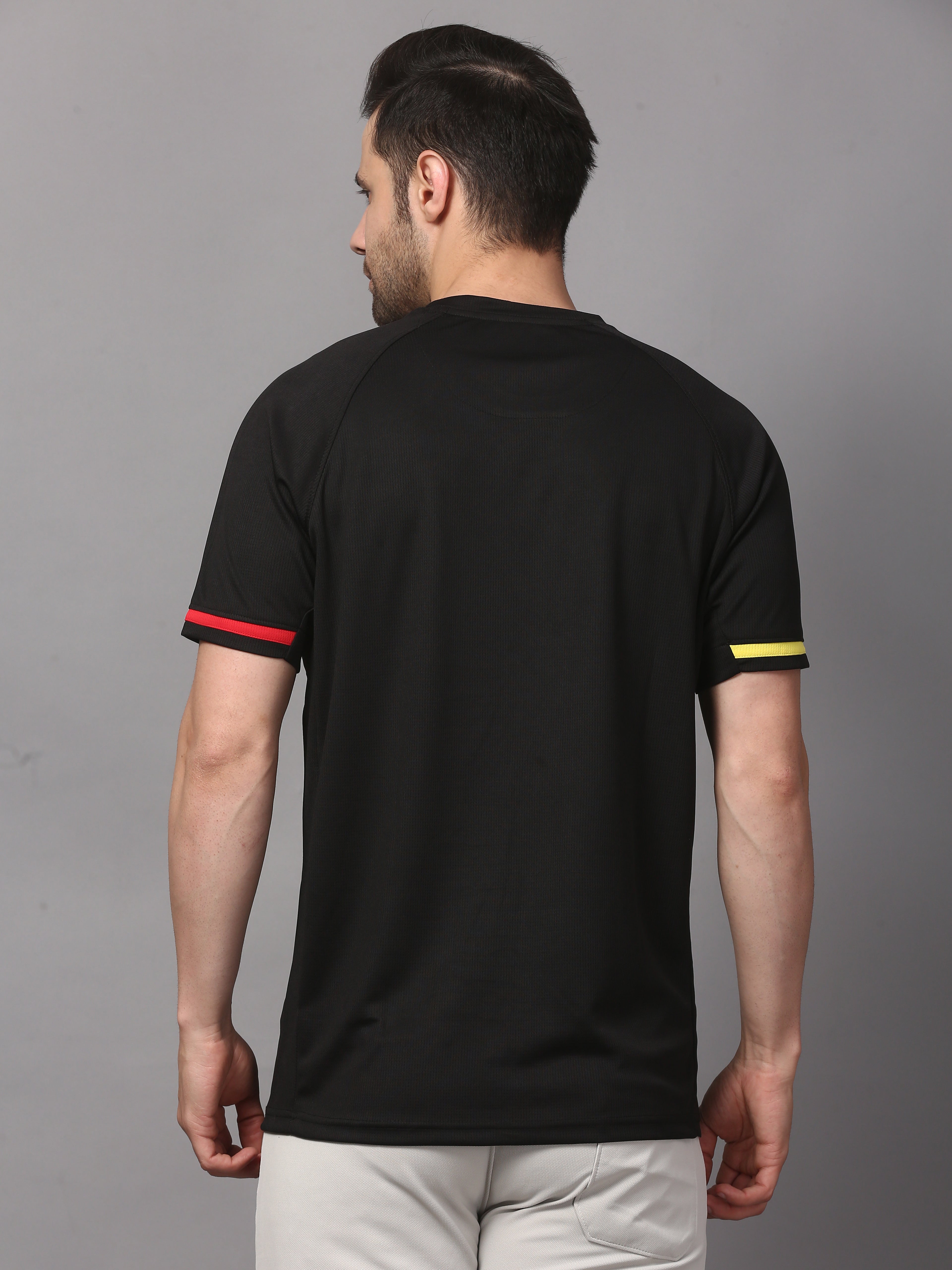 Man wearing a black t-shirt with colored sleeves 