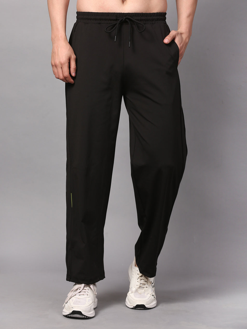 Person wearing black trackpants 