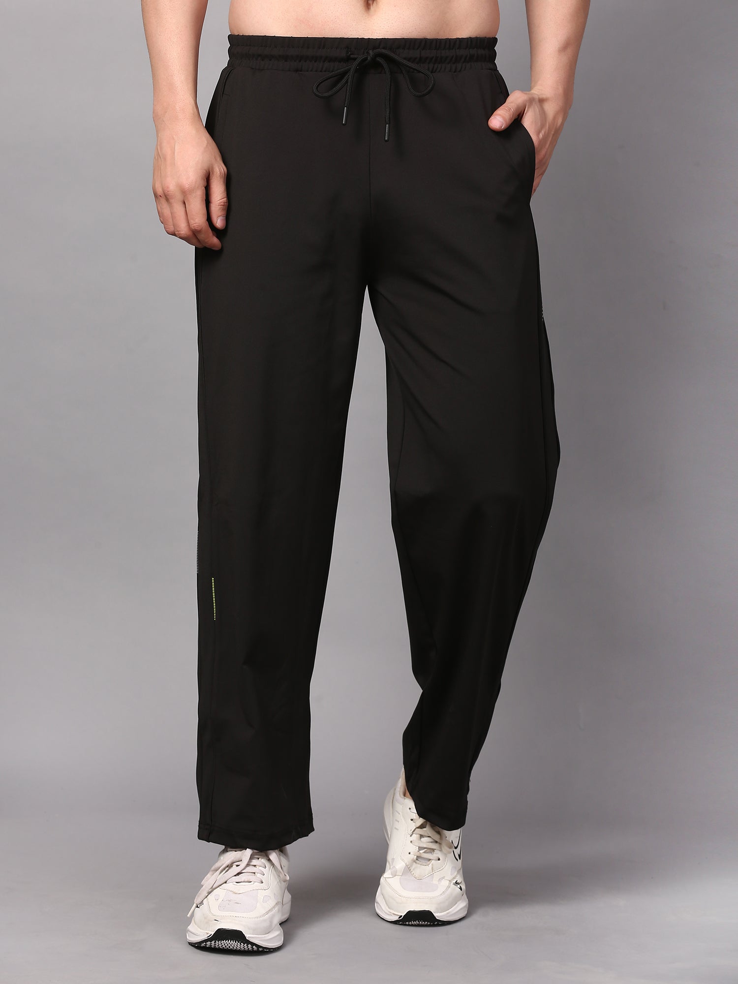 Person wearing black trackpants 