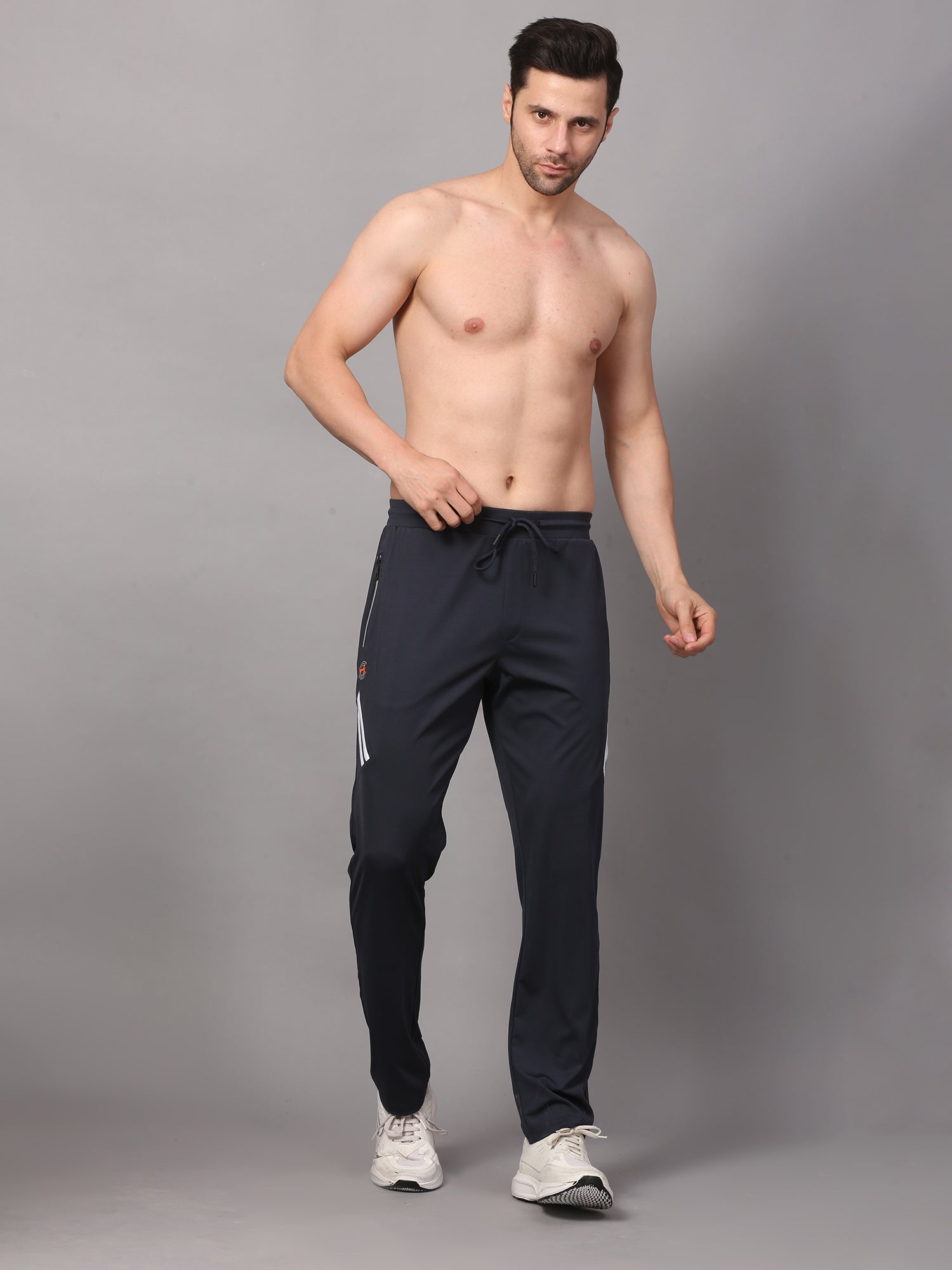 a pair of joggers with a drawstring and pockets