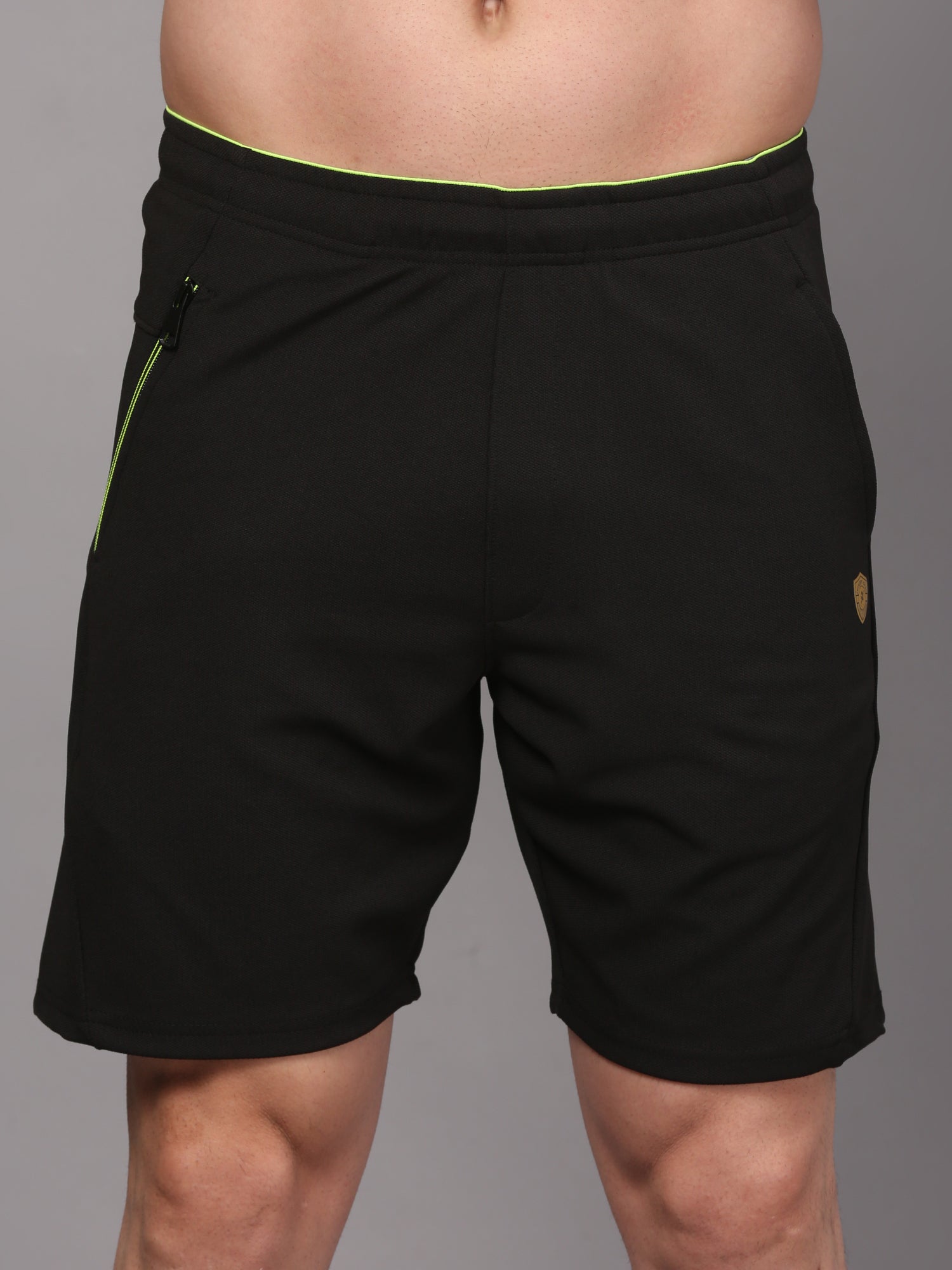 Black shorts with green accents 