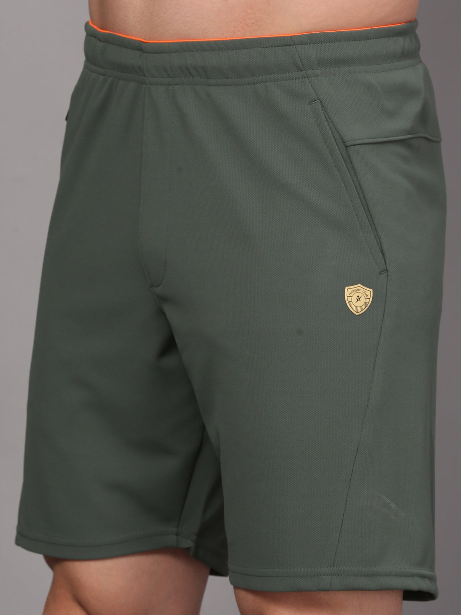 Green shorts with a logo