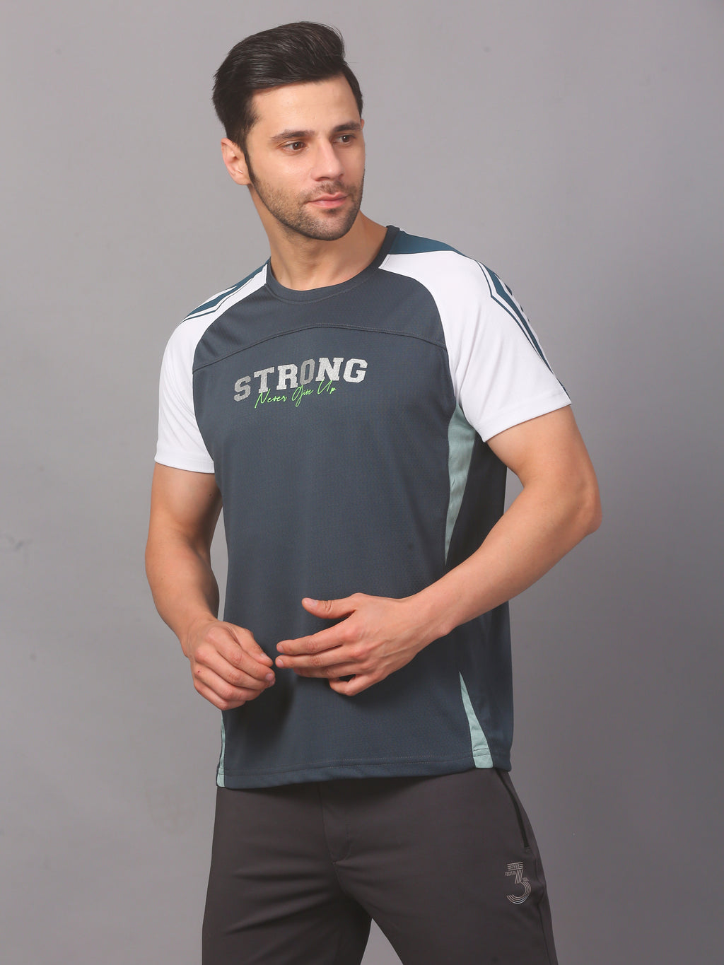 Man wearing a blue athletic shirt with text on a gray background