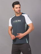 Man wearing a blue athletic shirt with text on a gray background