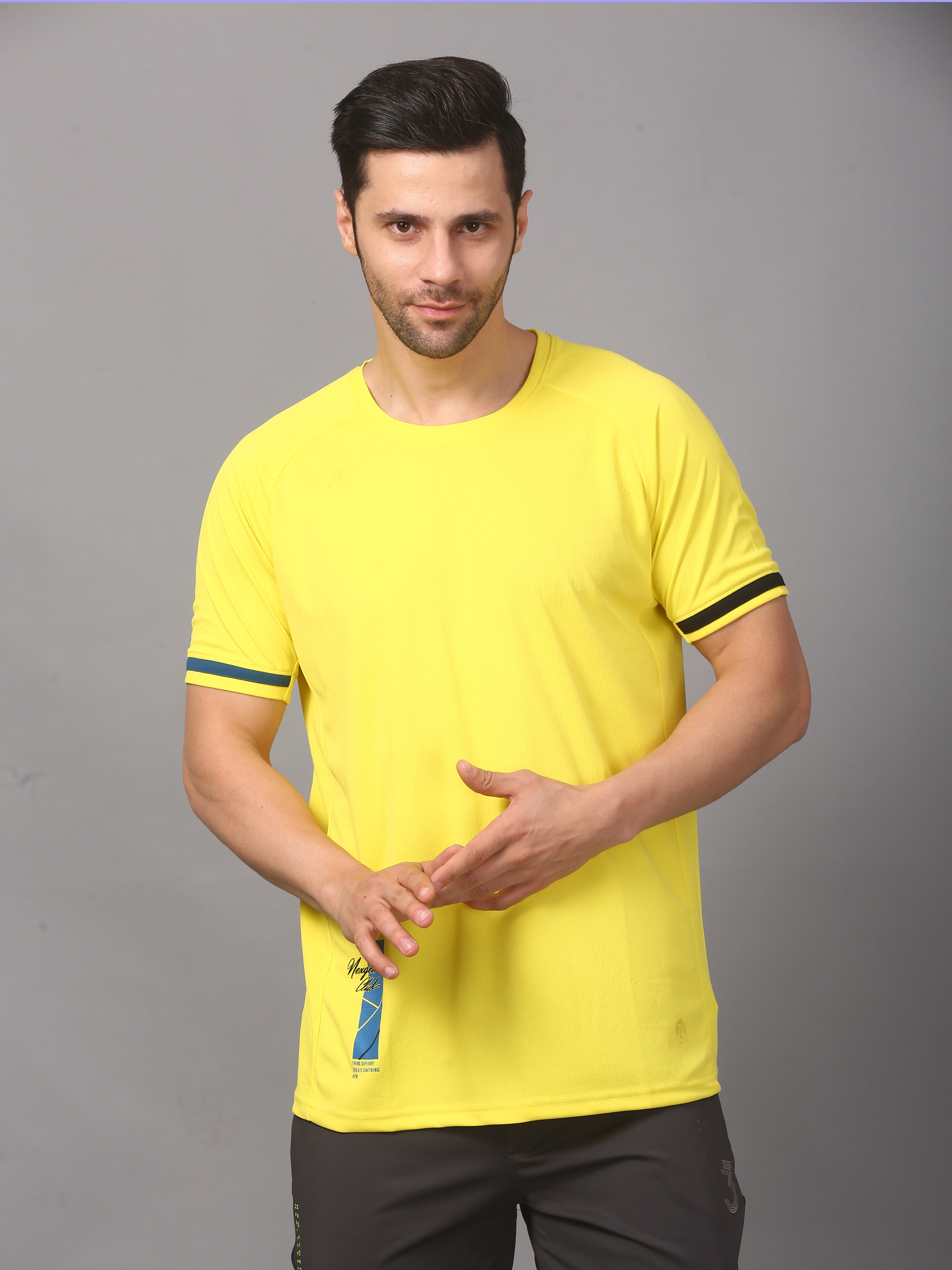 Man wearing a bright yellow t-shirt with black trim 