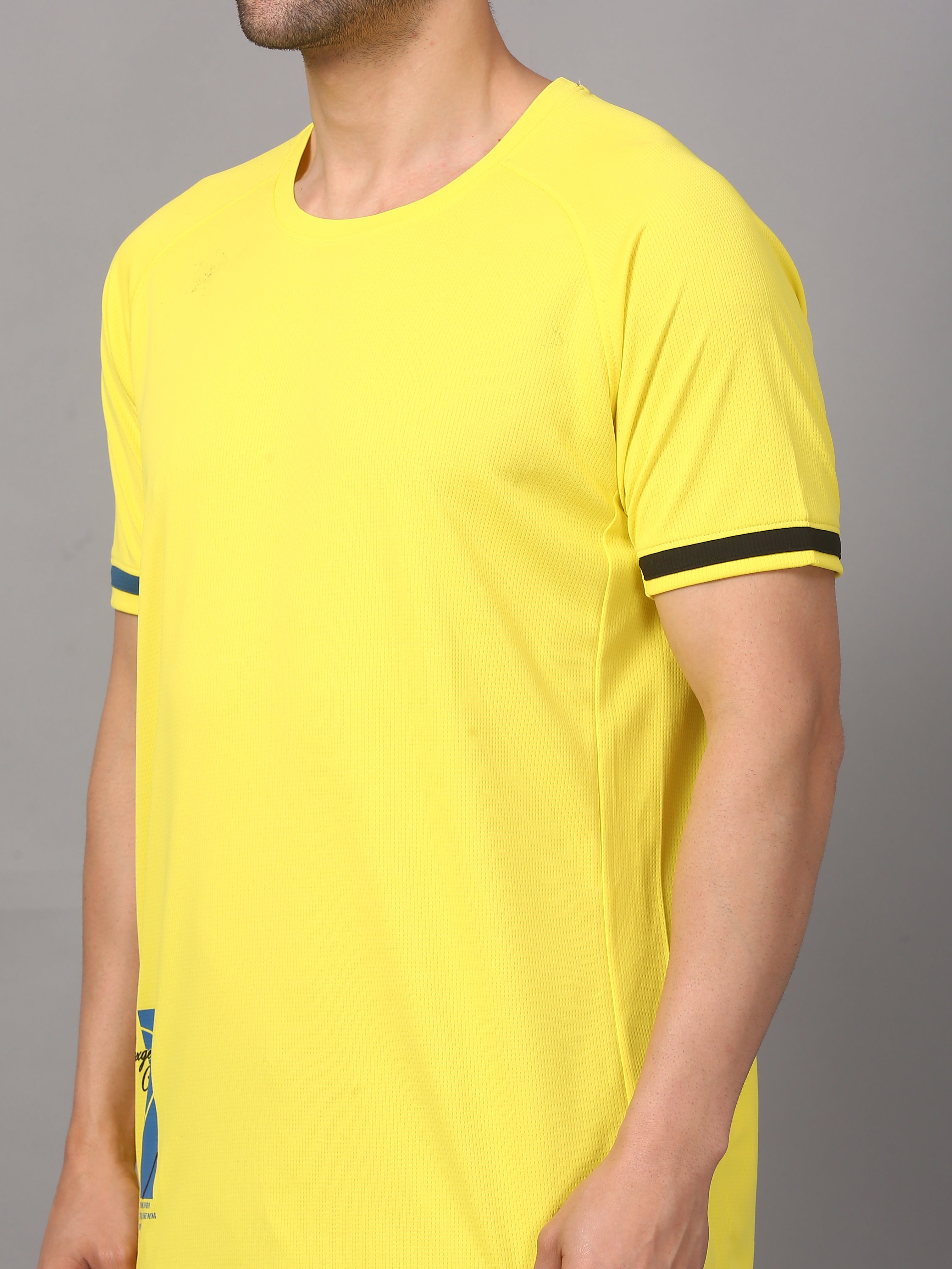 Yellow t-shirt with black trim worn by a person 