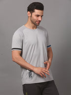 Man wearing a gray athletic shirt with black accents 