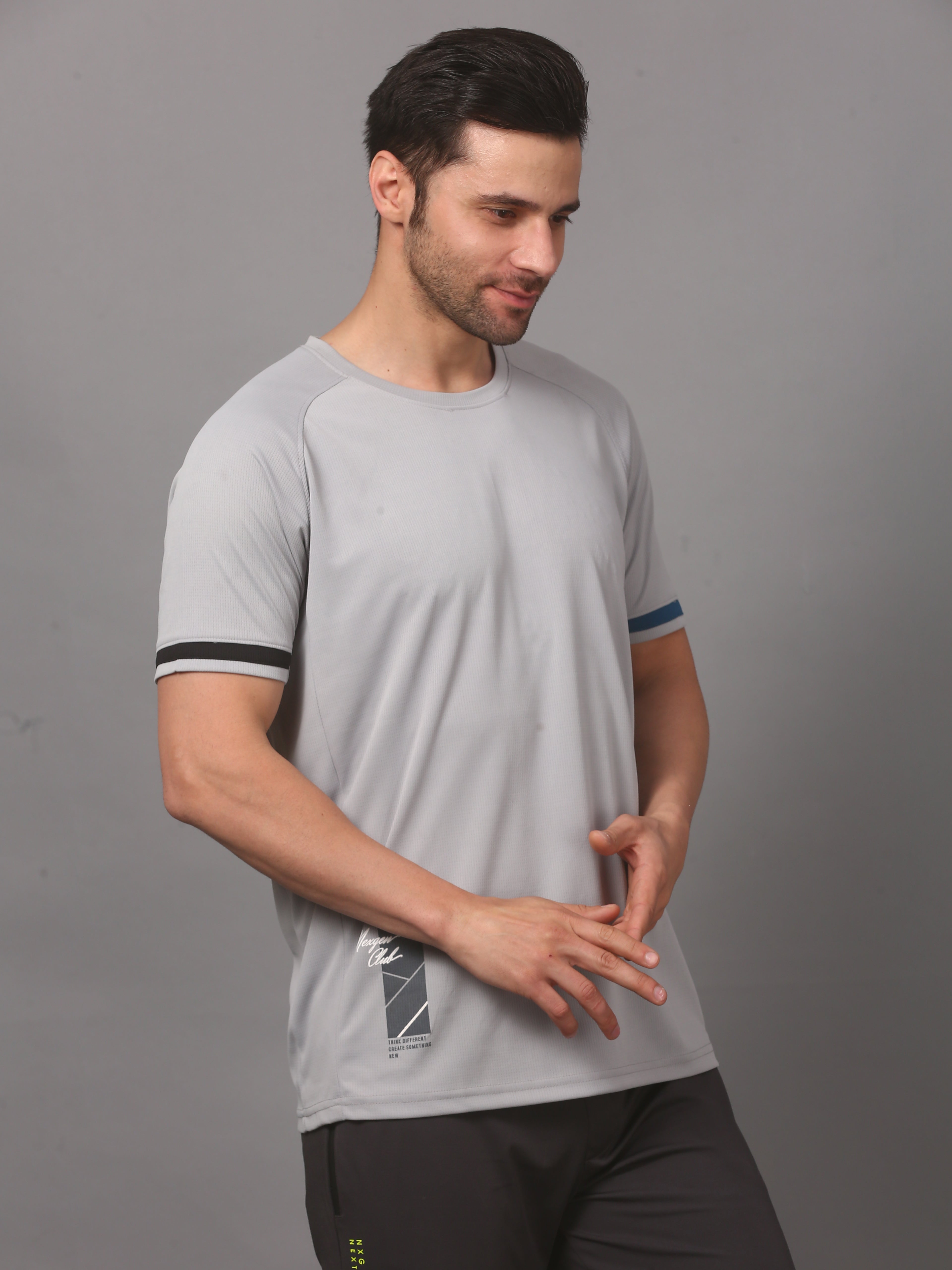 Man wearing a gray athletic shirt with black accents