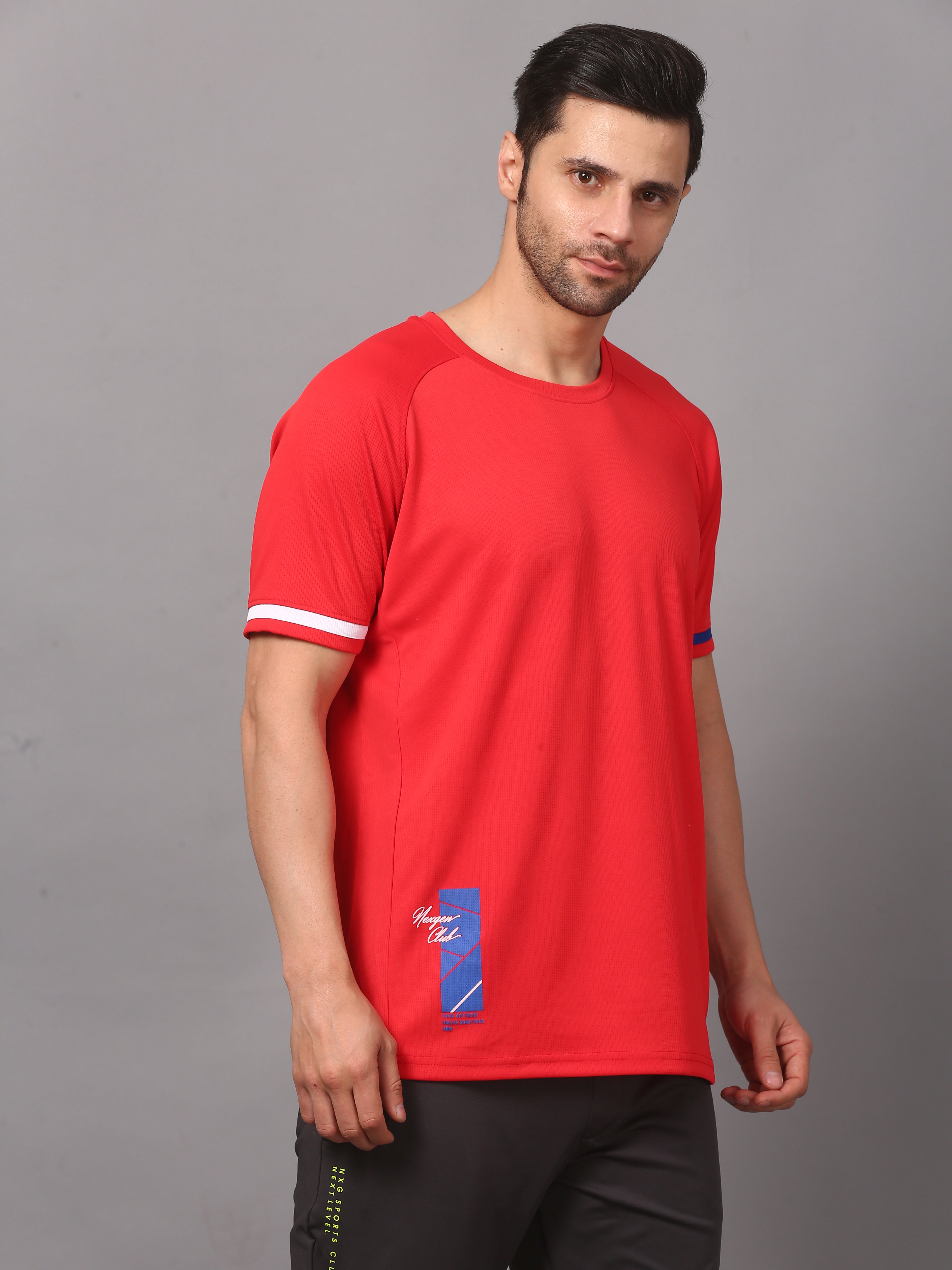 Man wearing a red sports jersey with a logo 