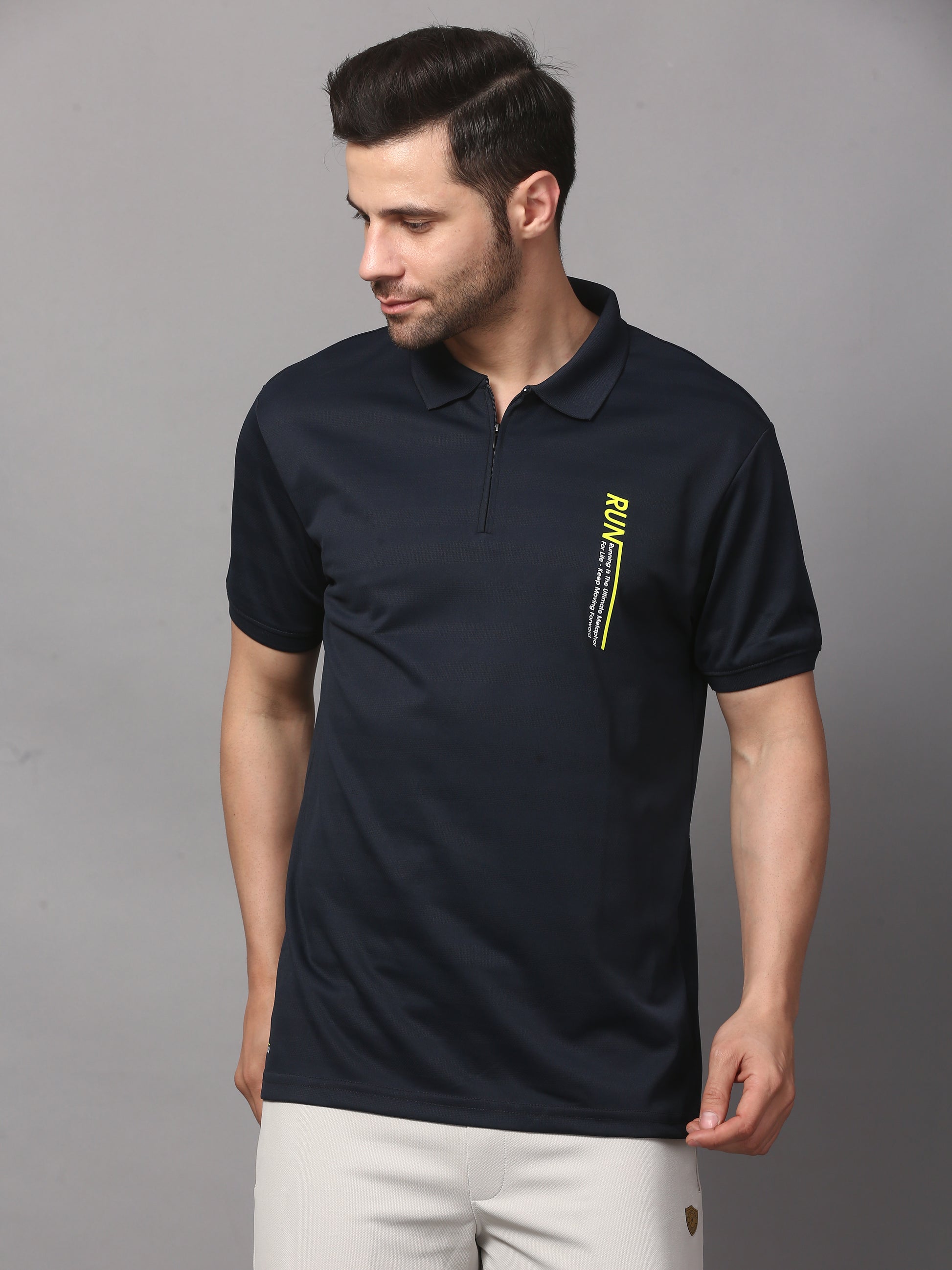 A navy blue polo t-shirt with a graphic on the chest.