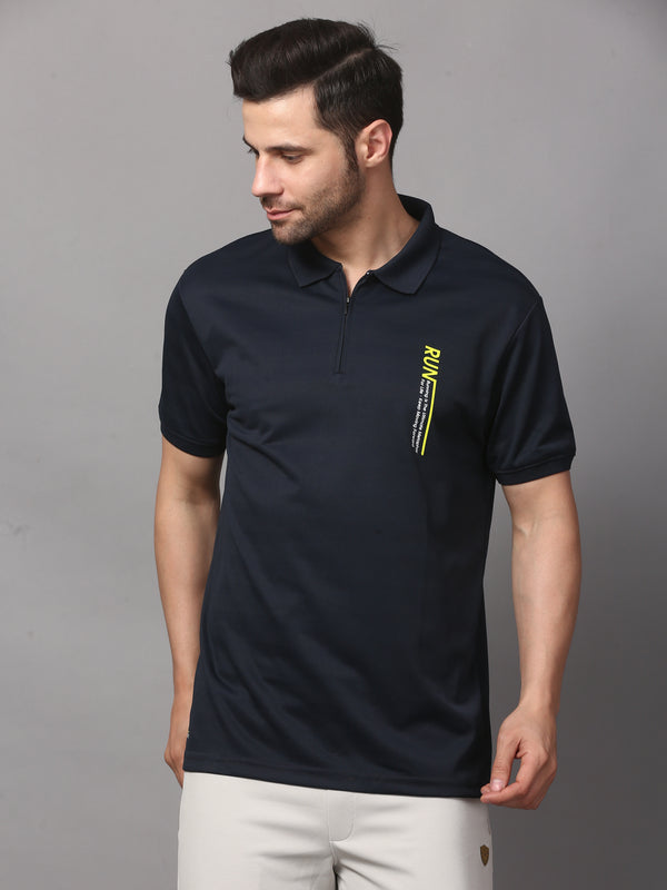 A navy blue polo t-shirt with a graphic on the chest.