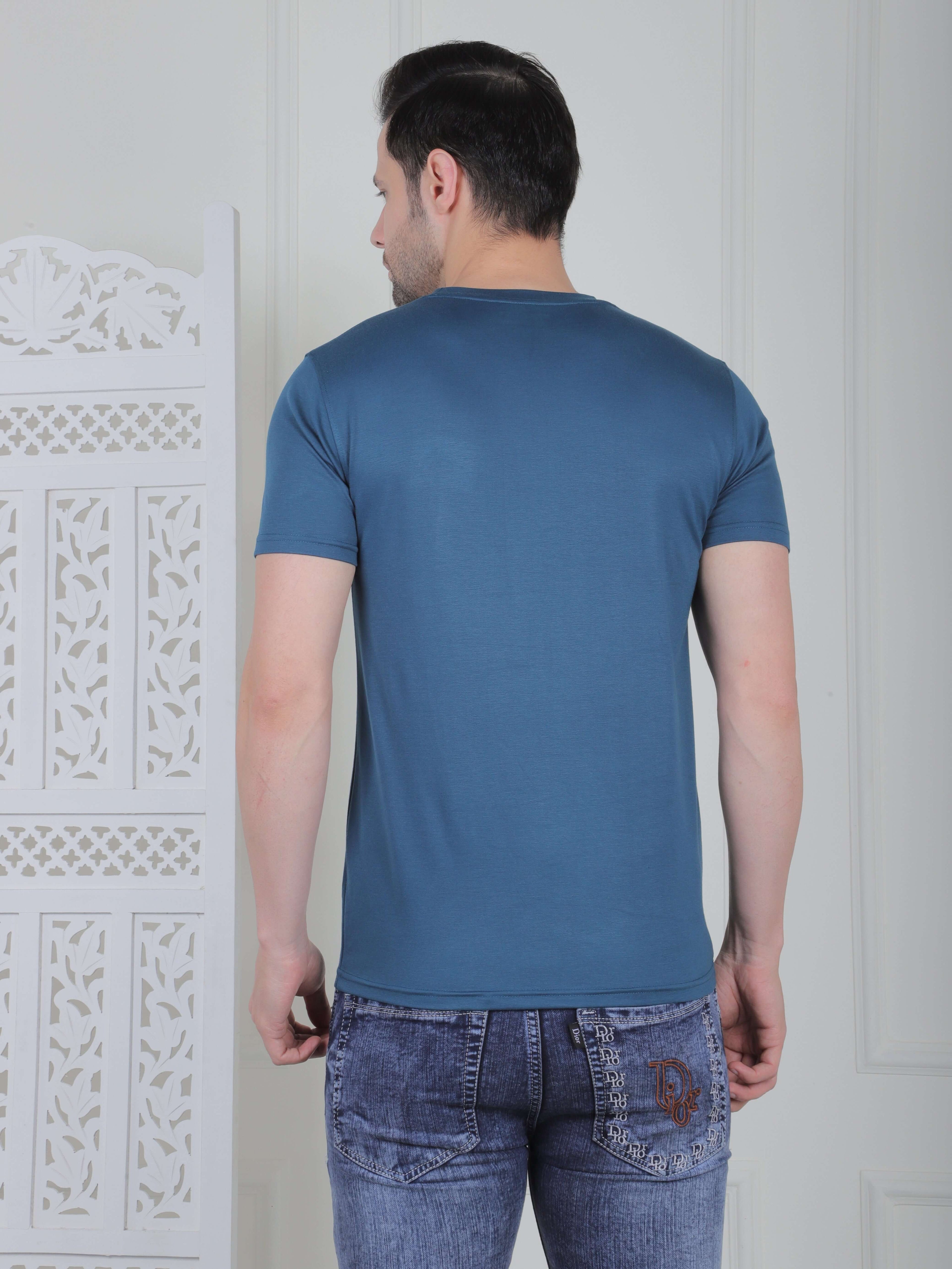 Rear view of a man wearing a stylish blue Men’s Casual Logo T-Shirt, showcasing its comfortable fit and clean design.