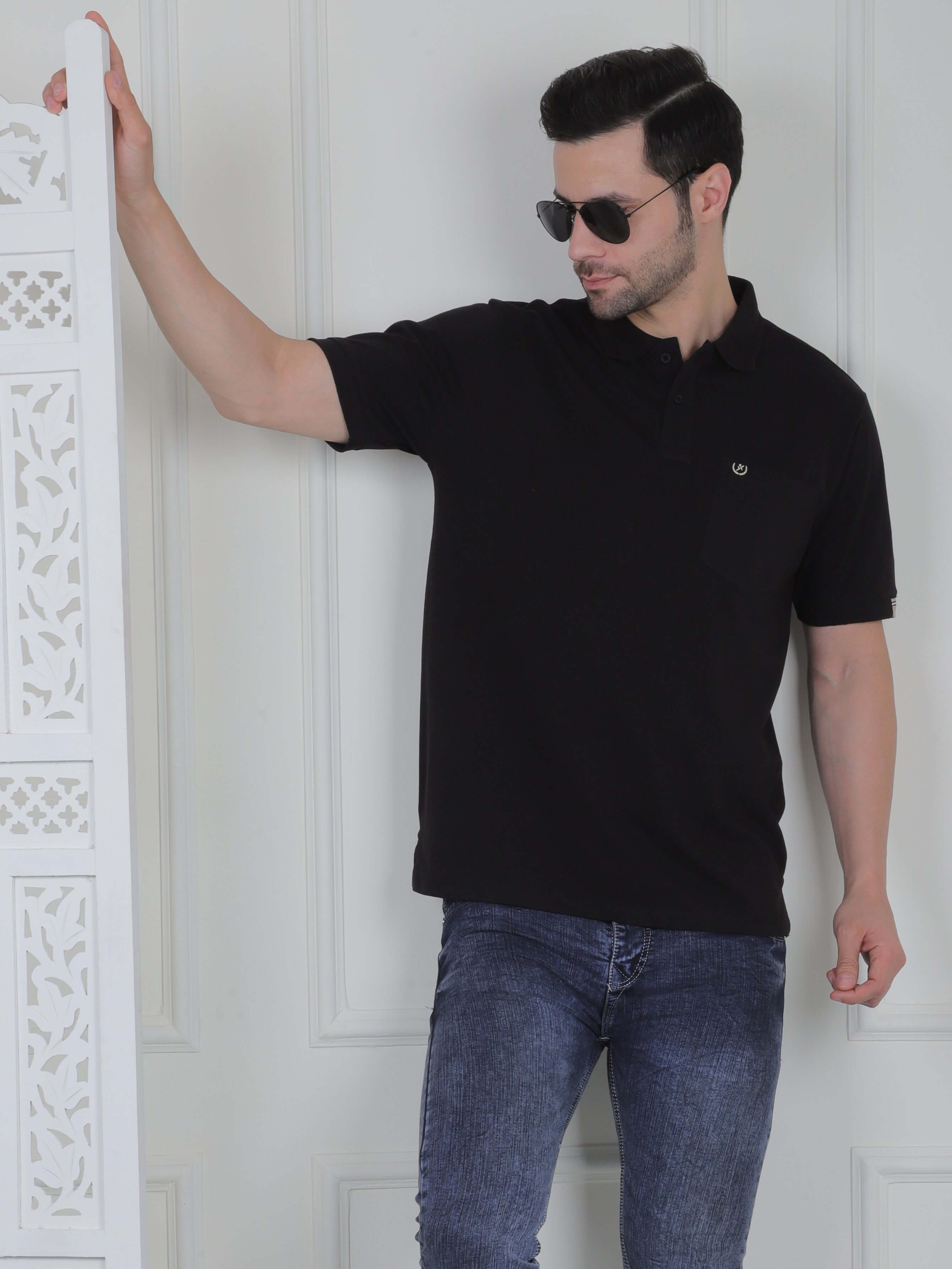 A black polo shirt with pockets