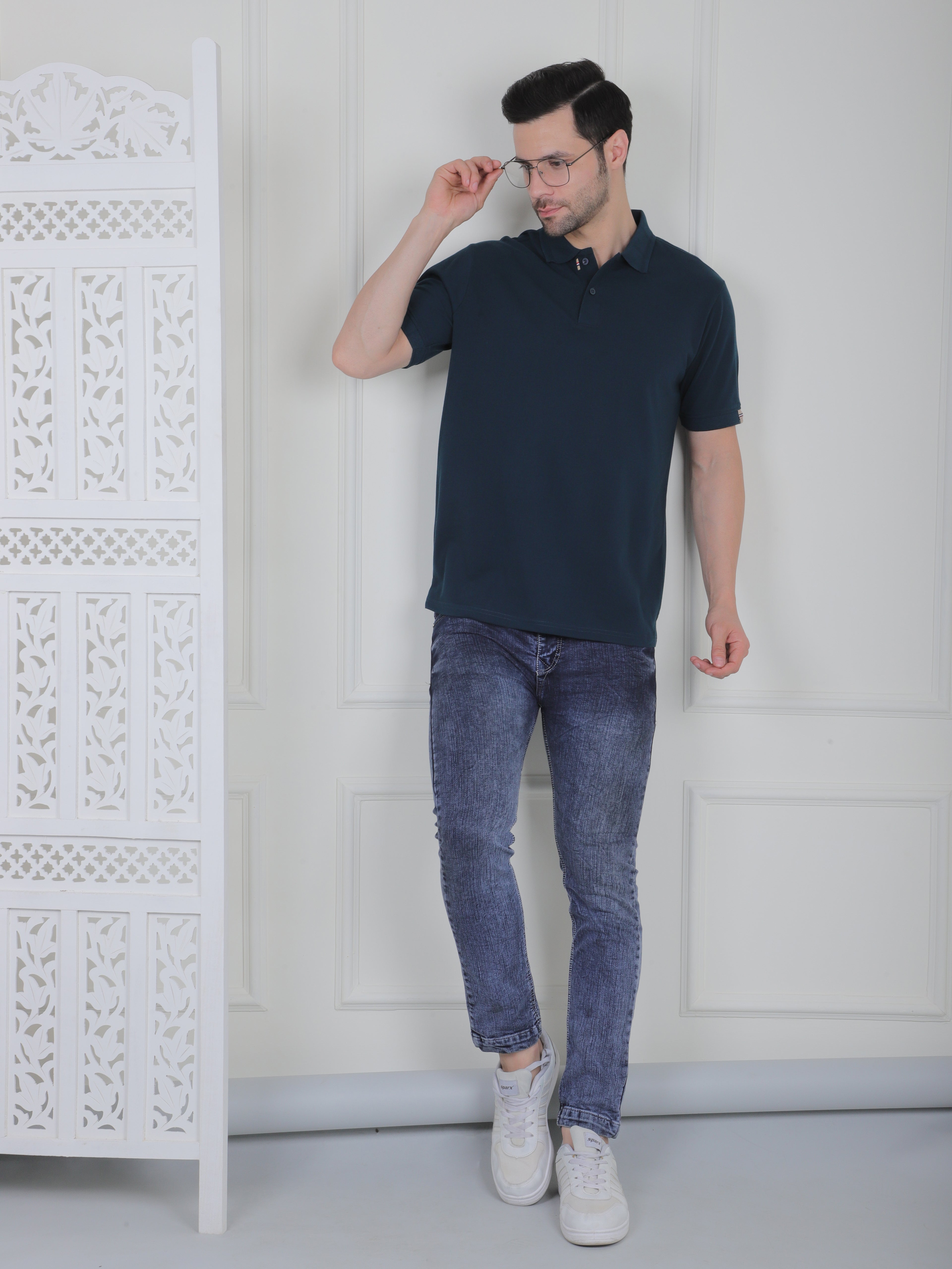 Man wearing a emerald green polo shirt