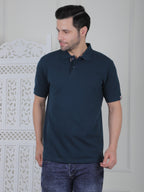 Man wearing a emerald green polo shirt