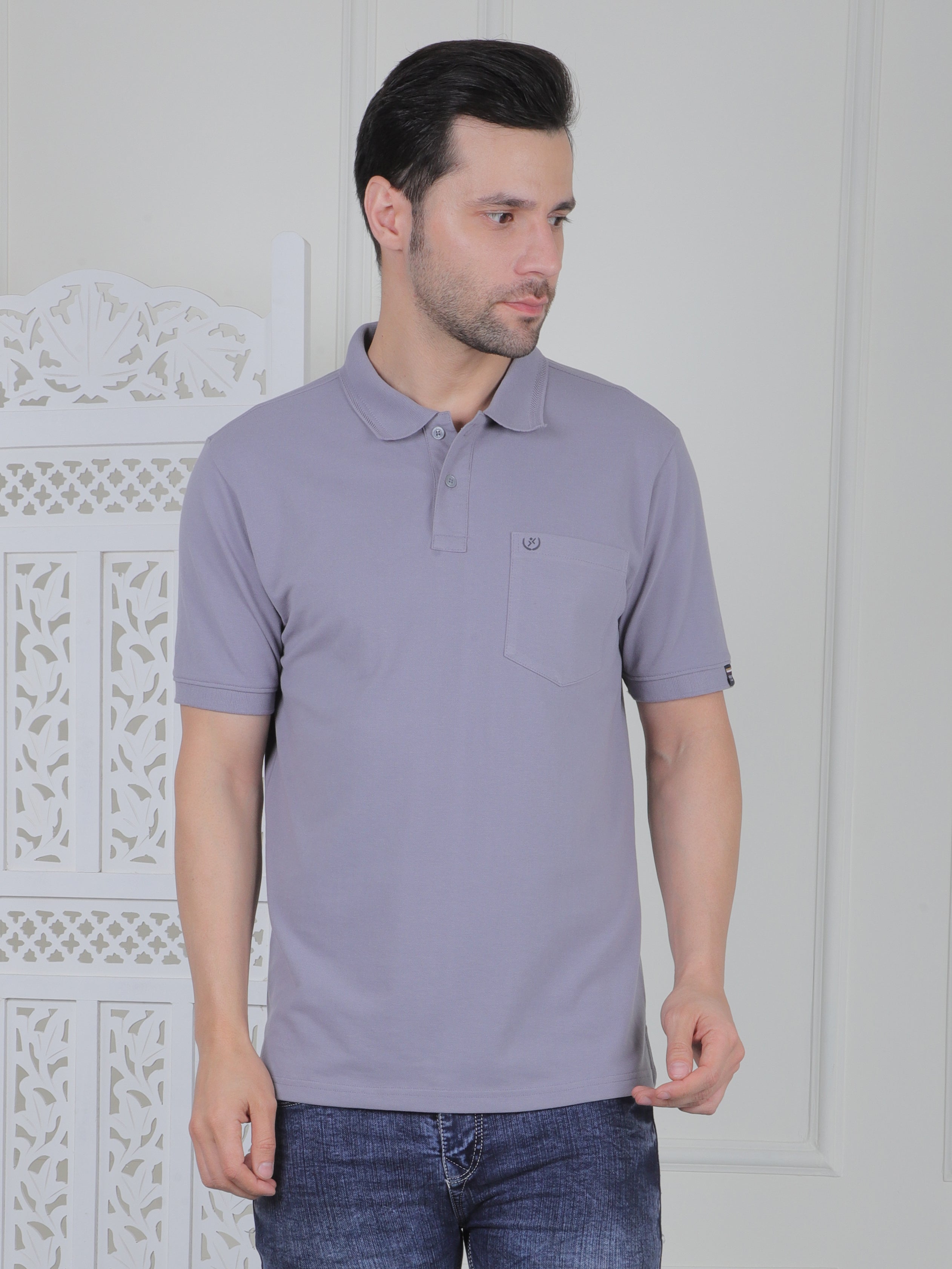Man wearing a grey polo shirt