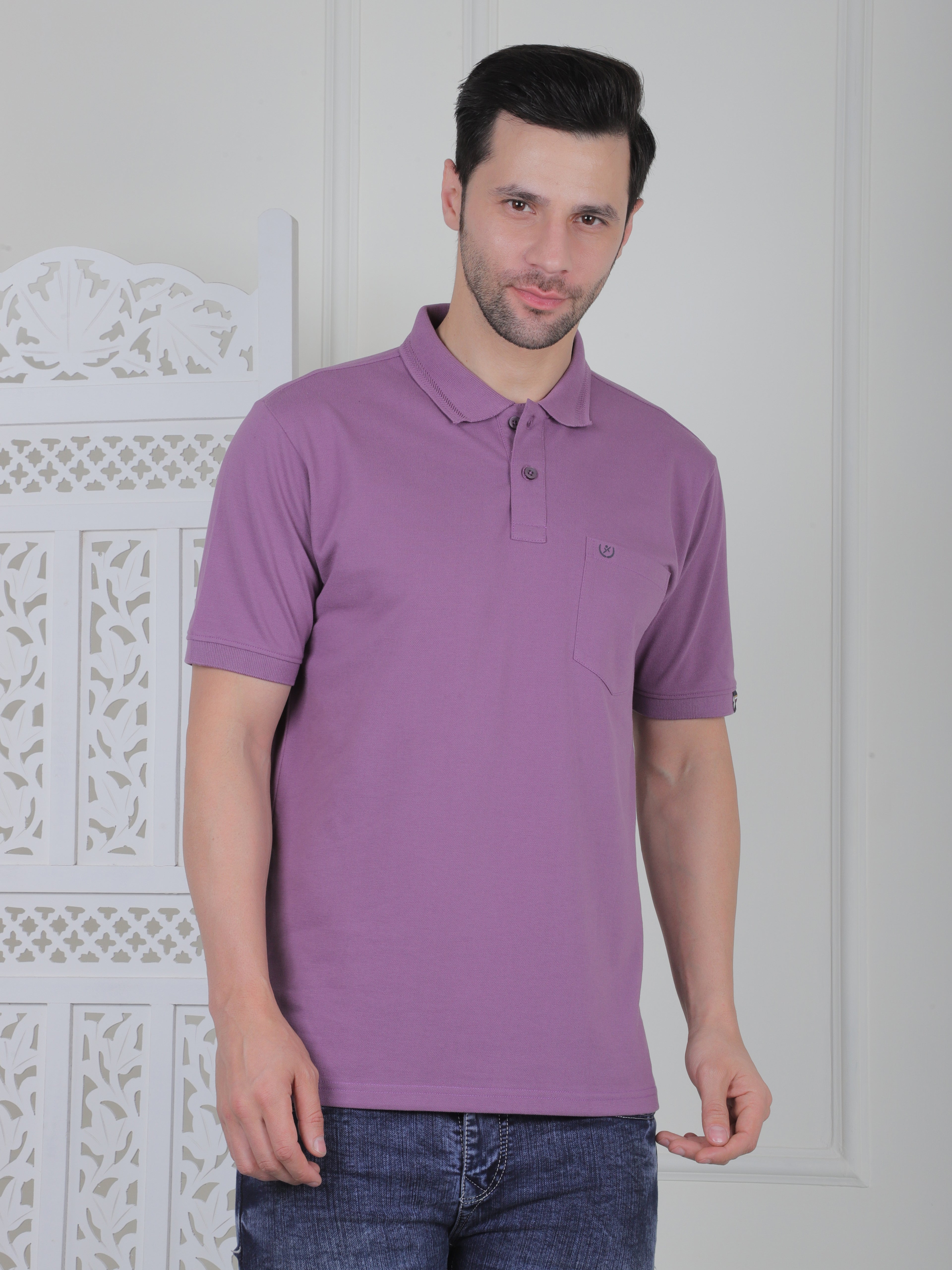 A lilac polo shirt with pockets
