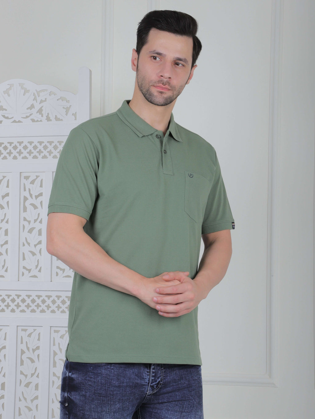 Men’s polo T-shirt in olive green with chest pocket, perfect for casual or smart casual wear.