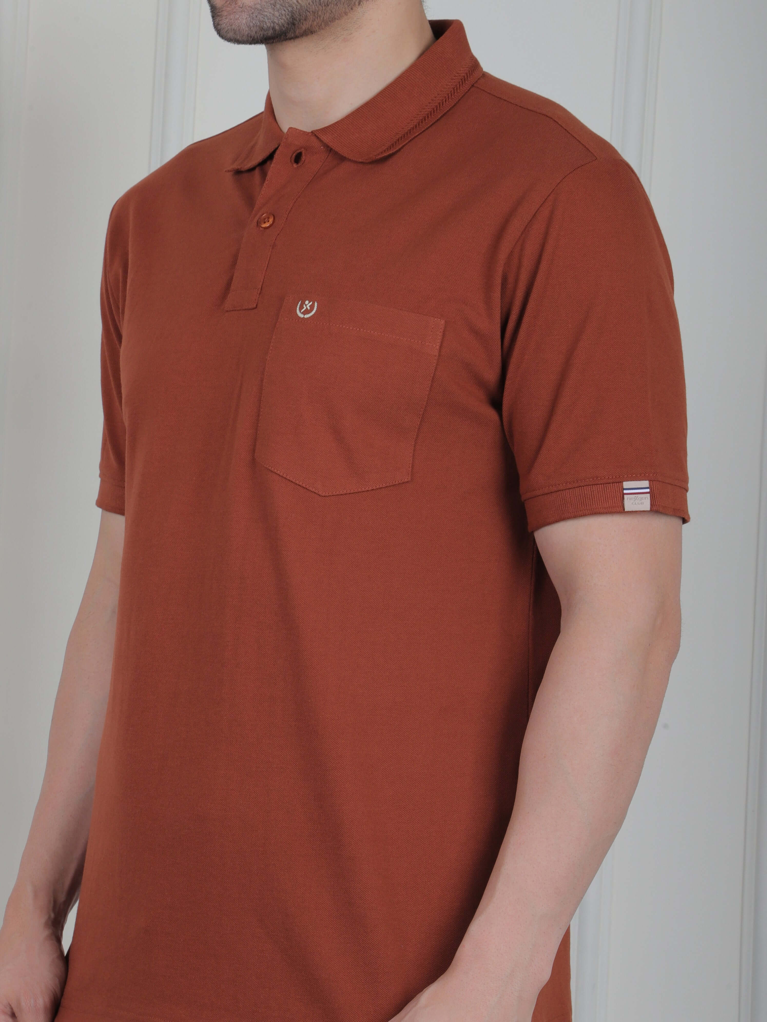 A rust brown polo shirt with pockets