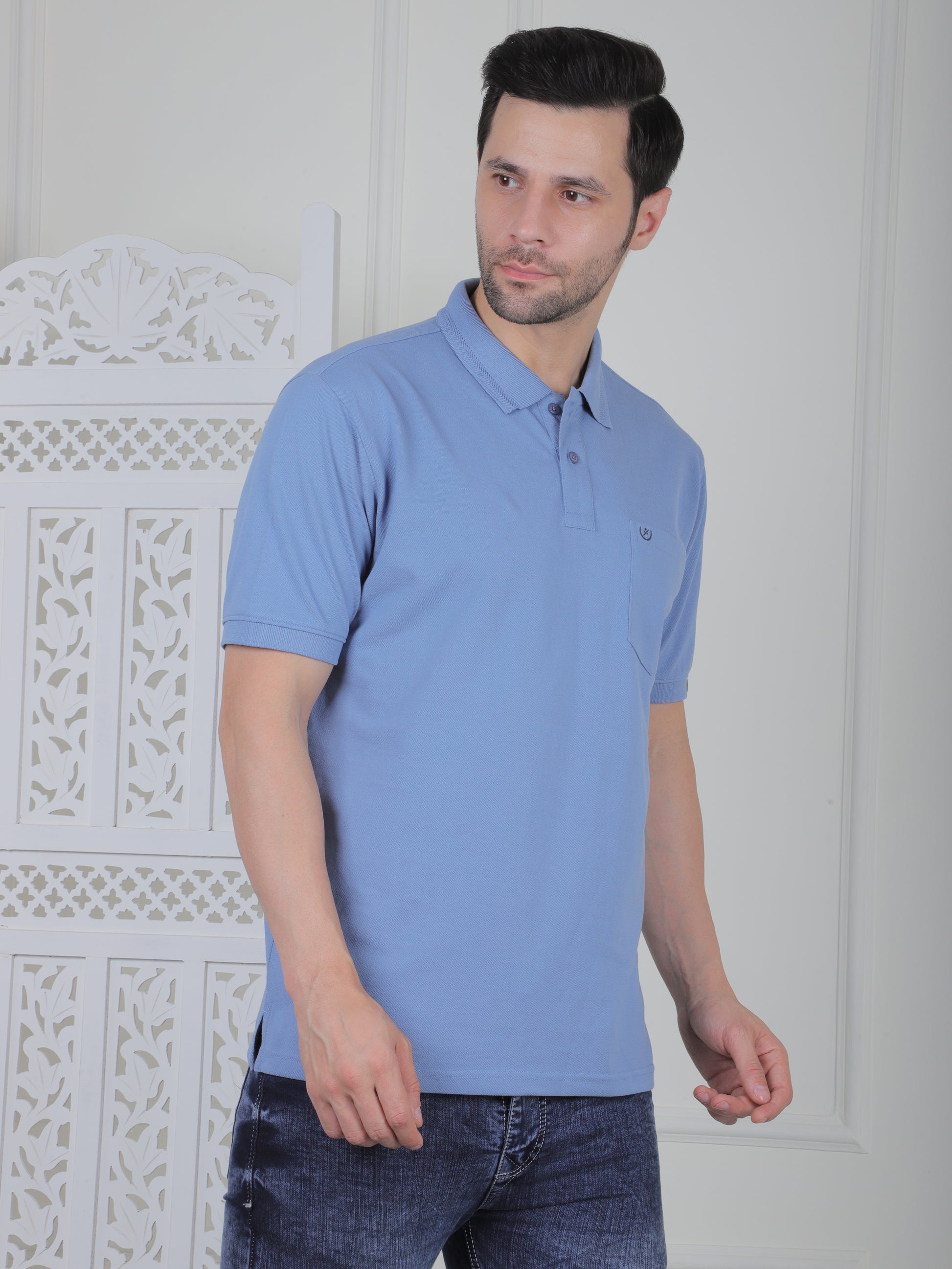 Man wearing a sky polo shirt