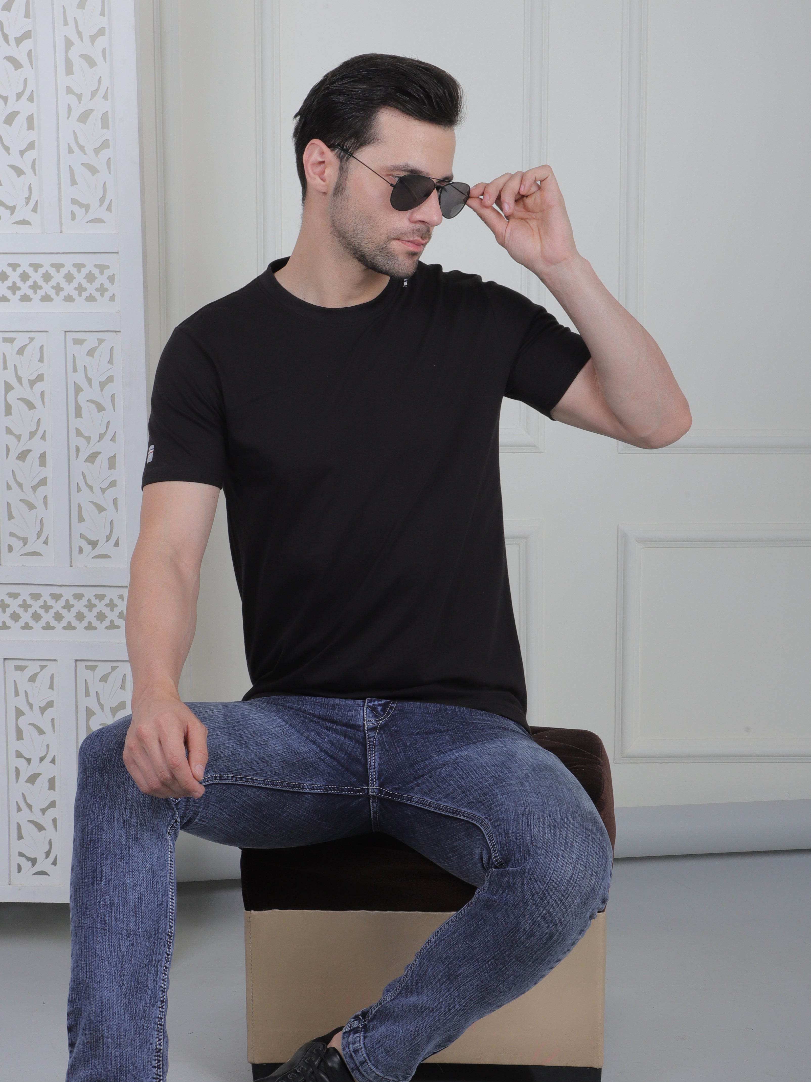 man wearing a black everyday basic tshirt