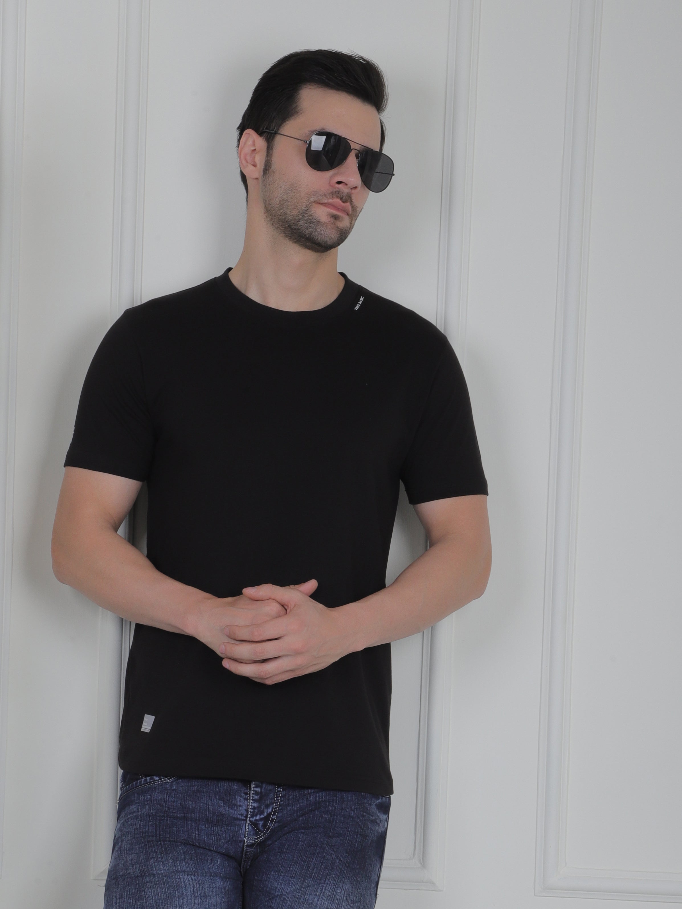man wearing a black everyday basic tshirt
