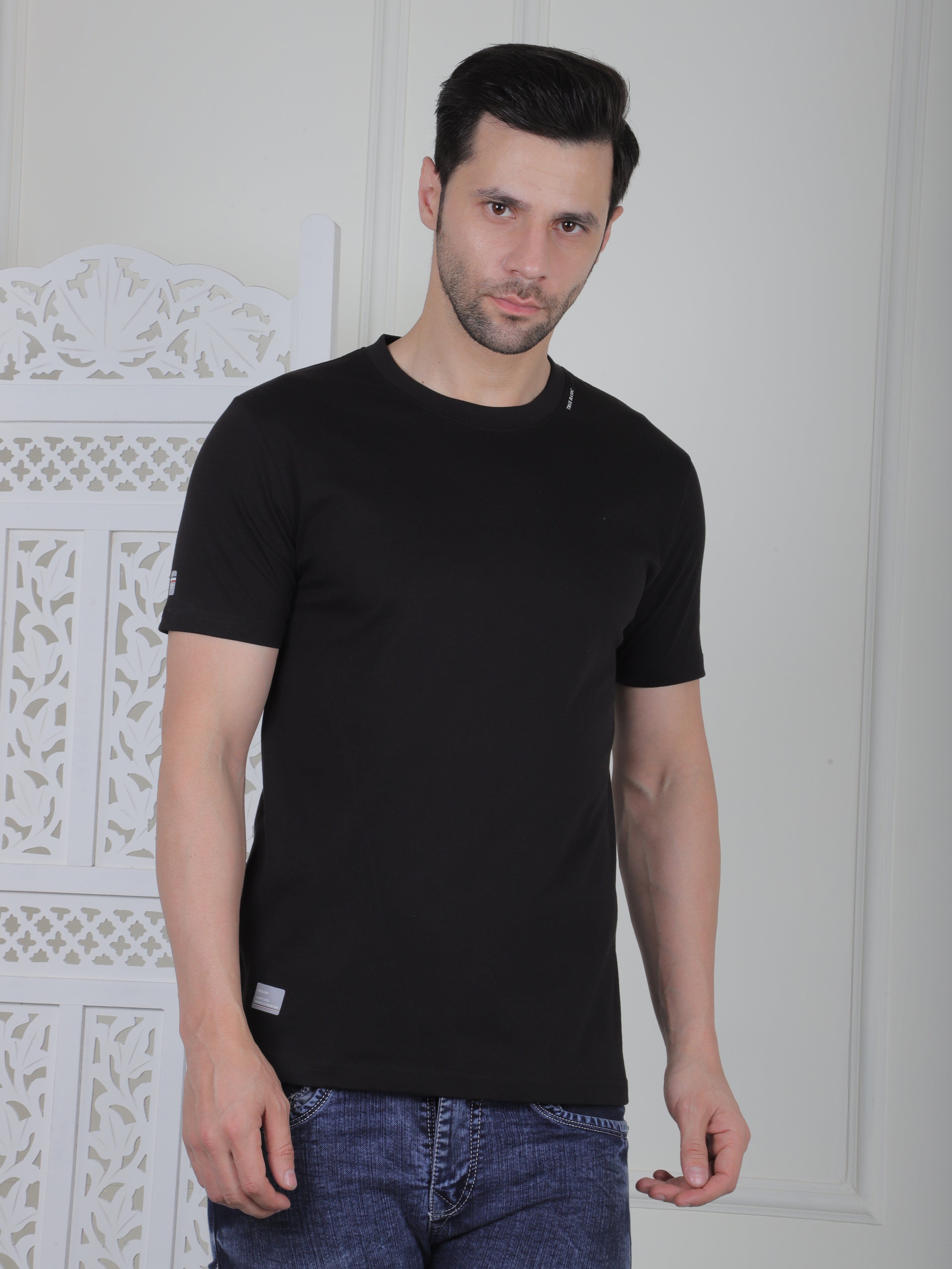 man wearing a black everyday basic tshirt