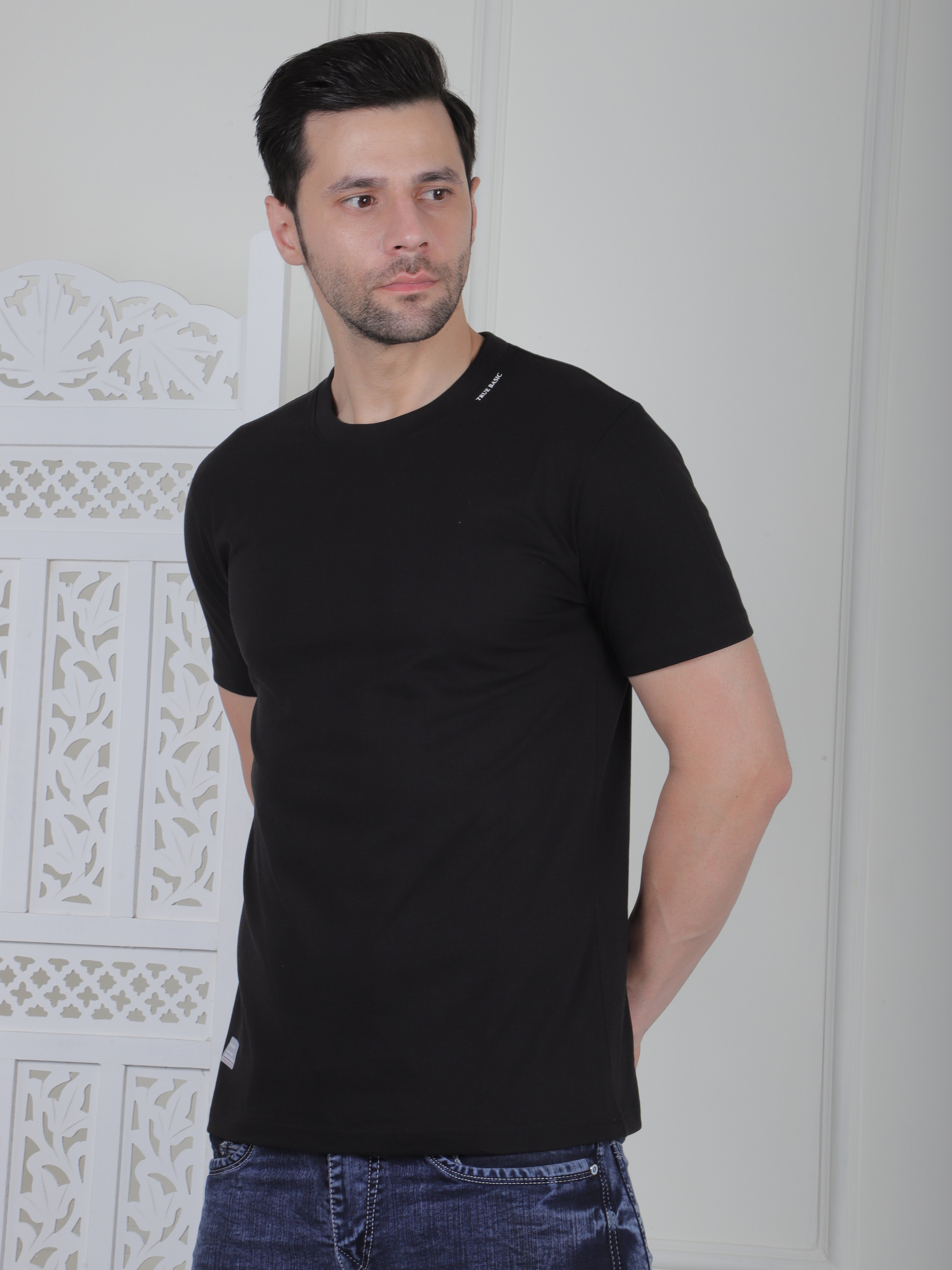 man wearing a black everyday basic tshirt