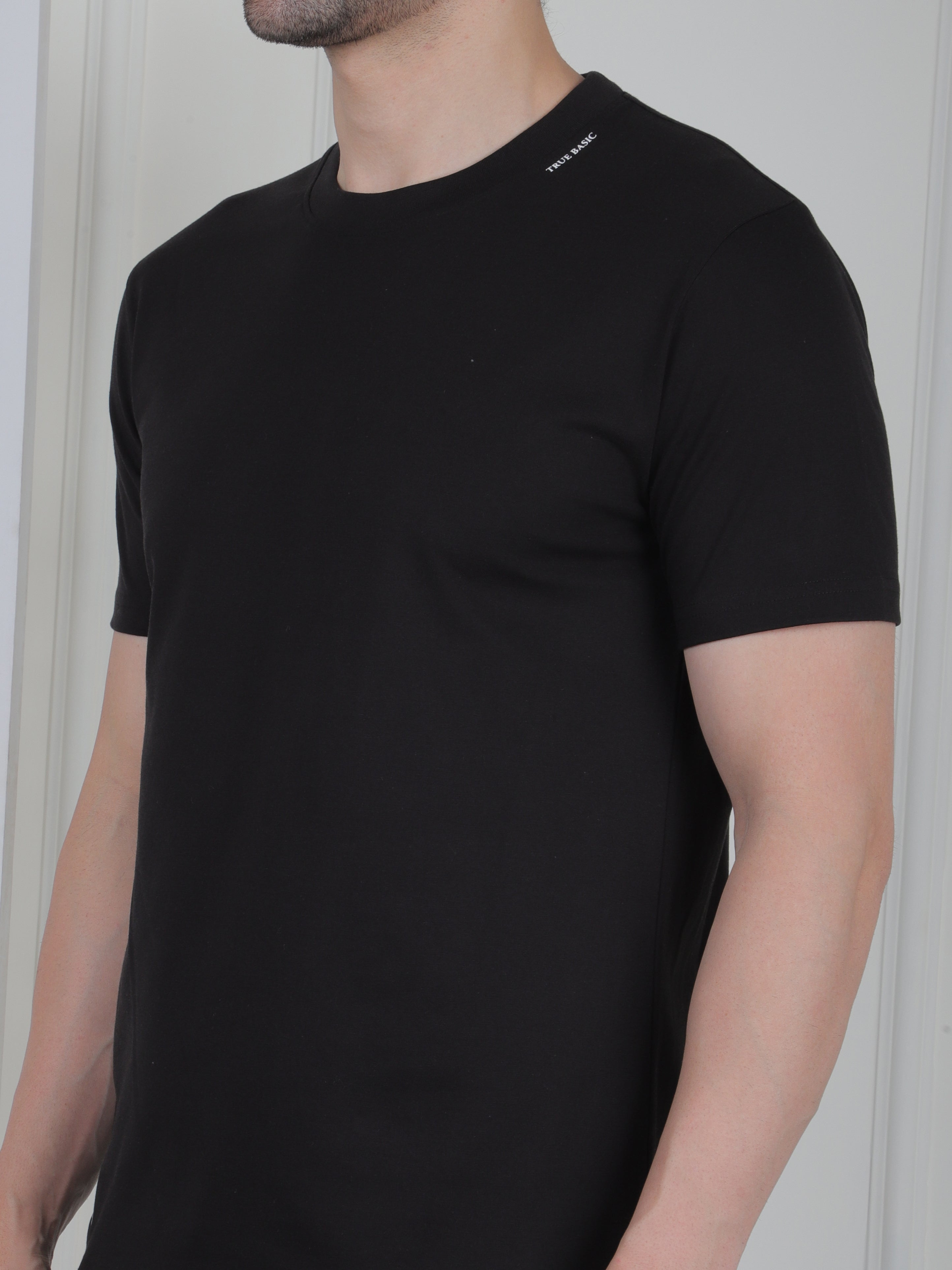 man wearing a black everyday basic tshirt