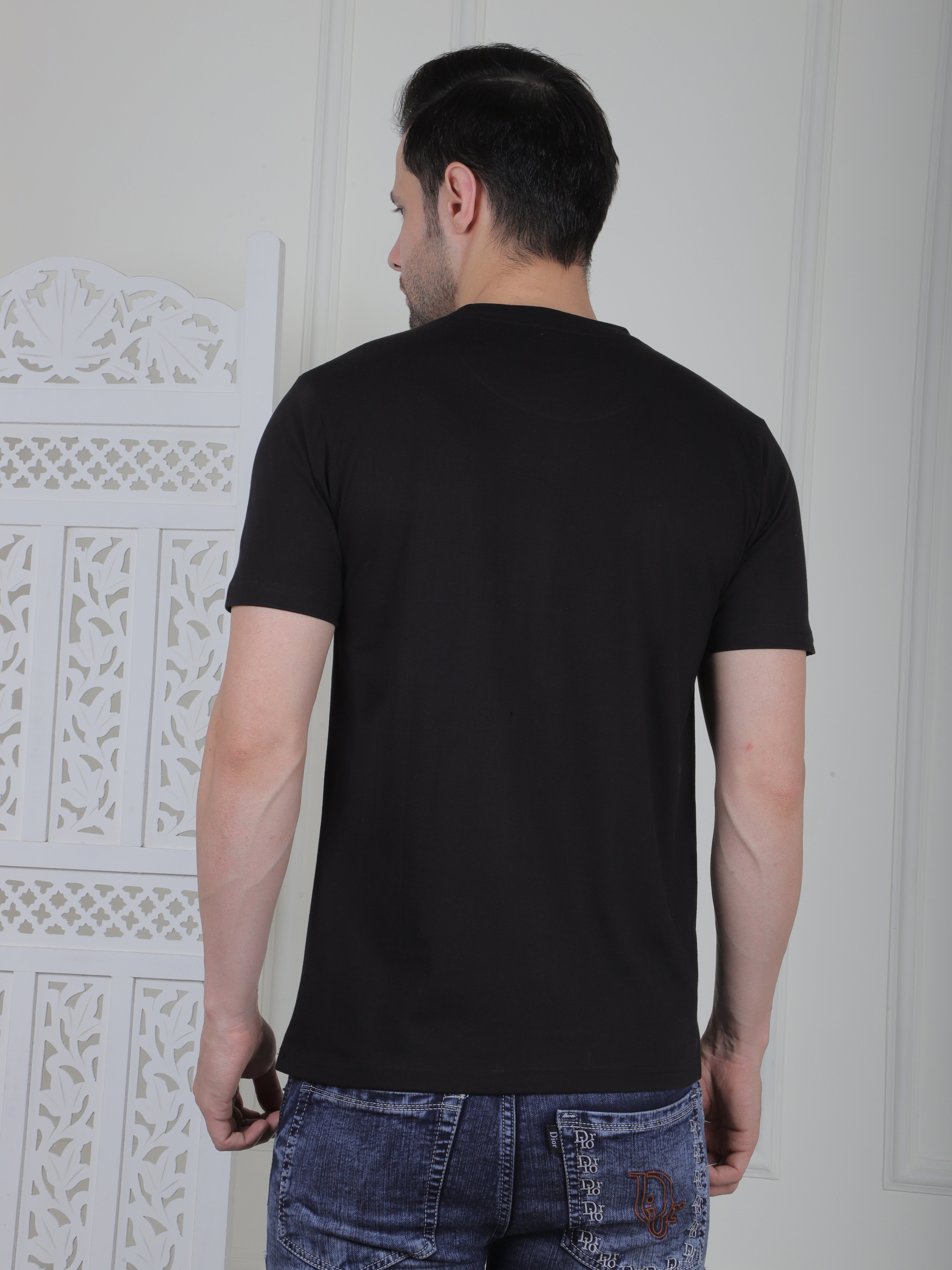 man wearing a black everyday basic tshirt