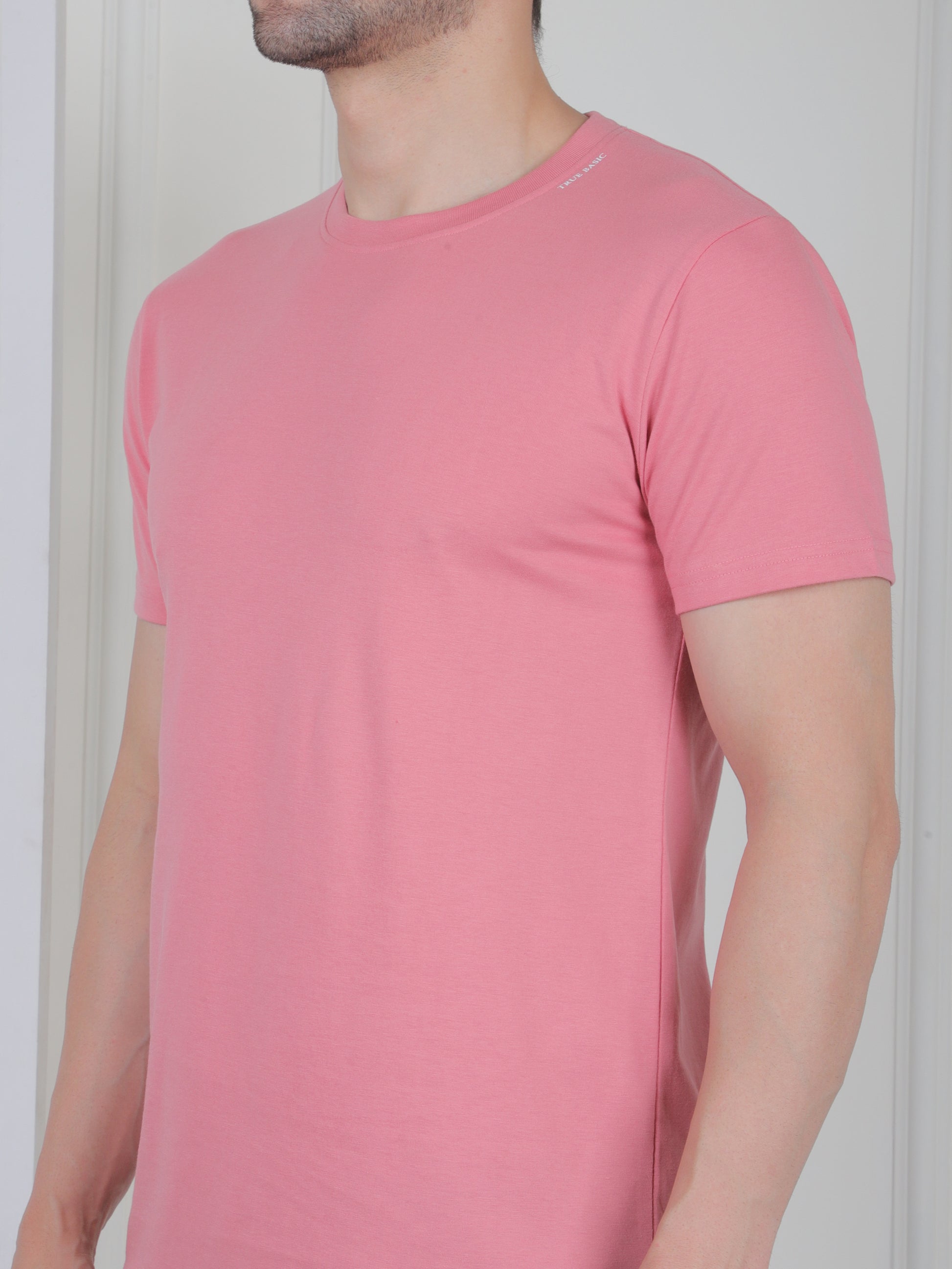 man wearing a pink everyday basic tshirt