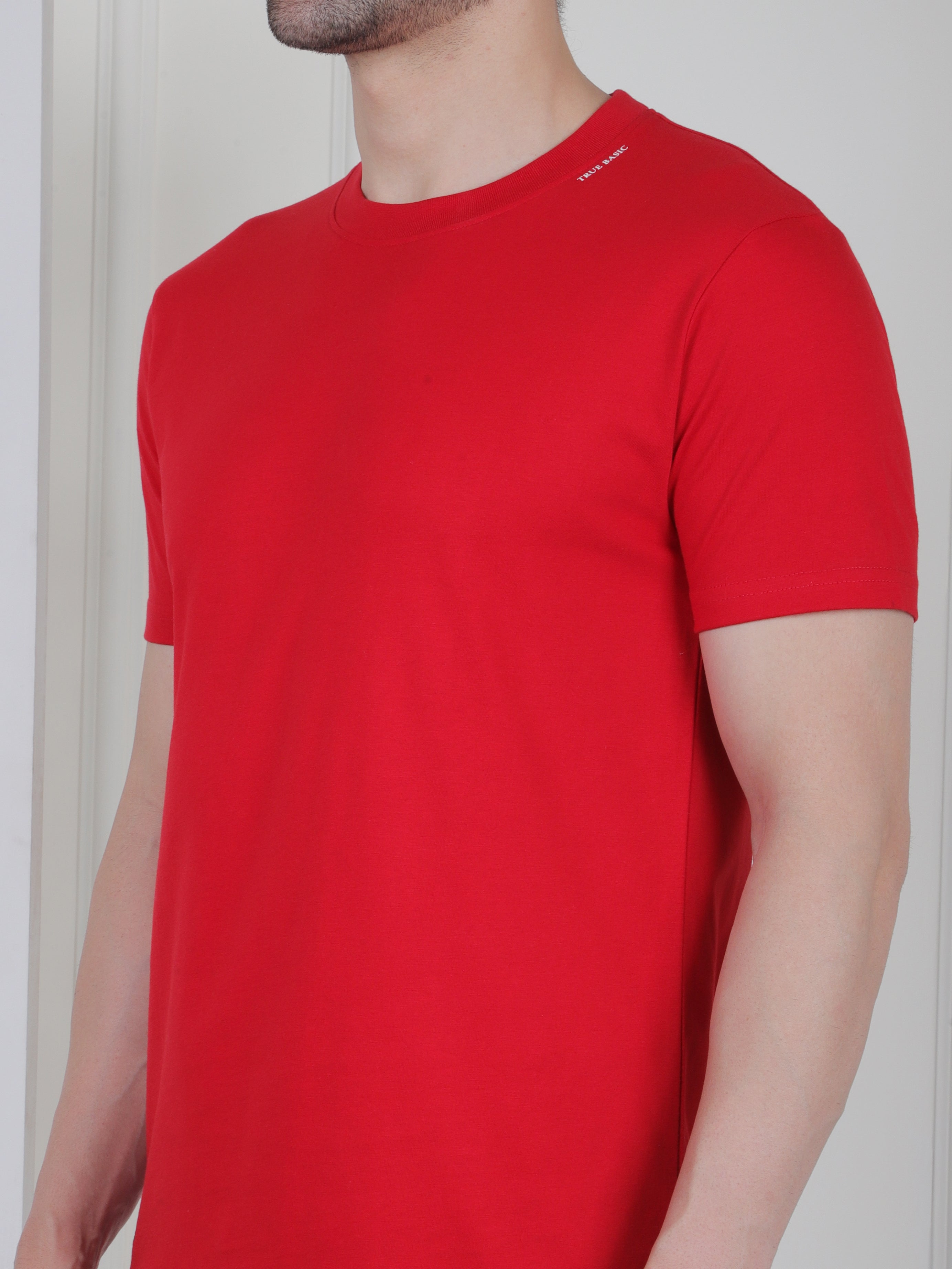 man wearing a red everyday basic tshirt