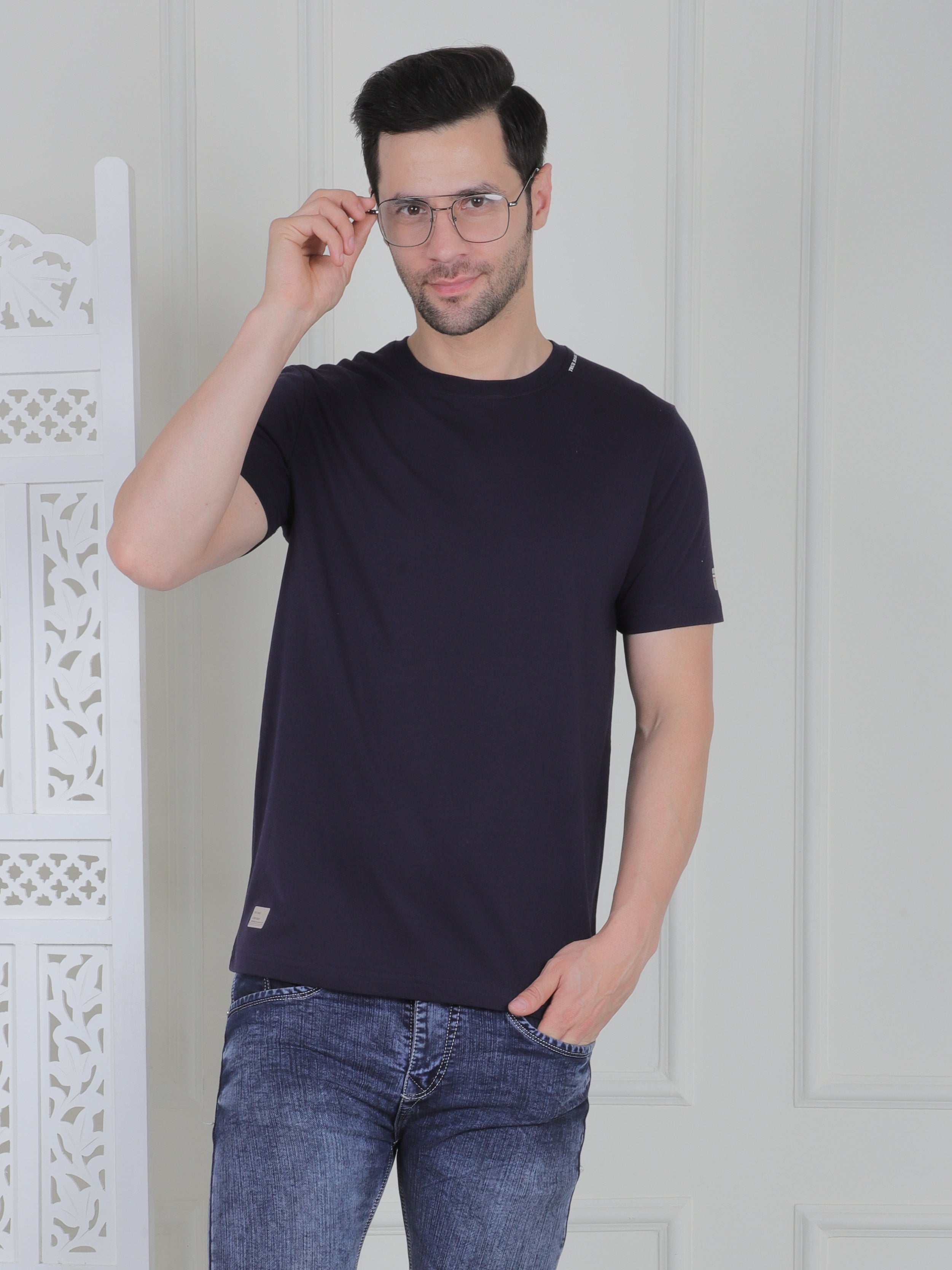 man wearing a navy everyday basic tshirt
