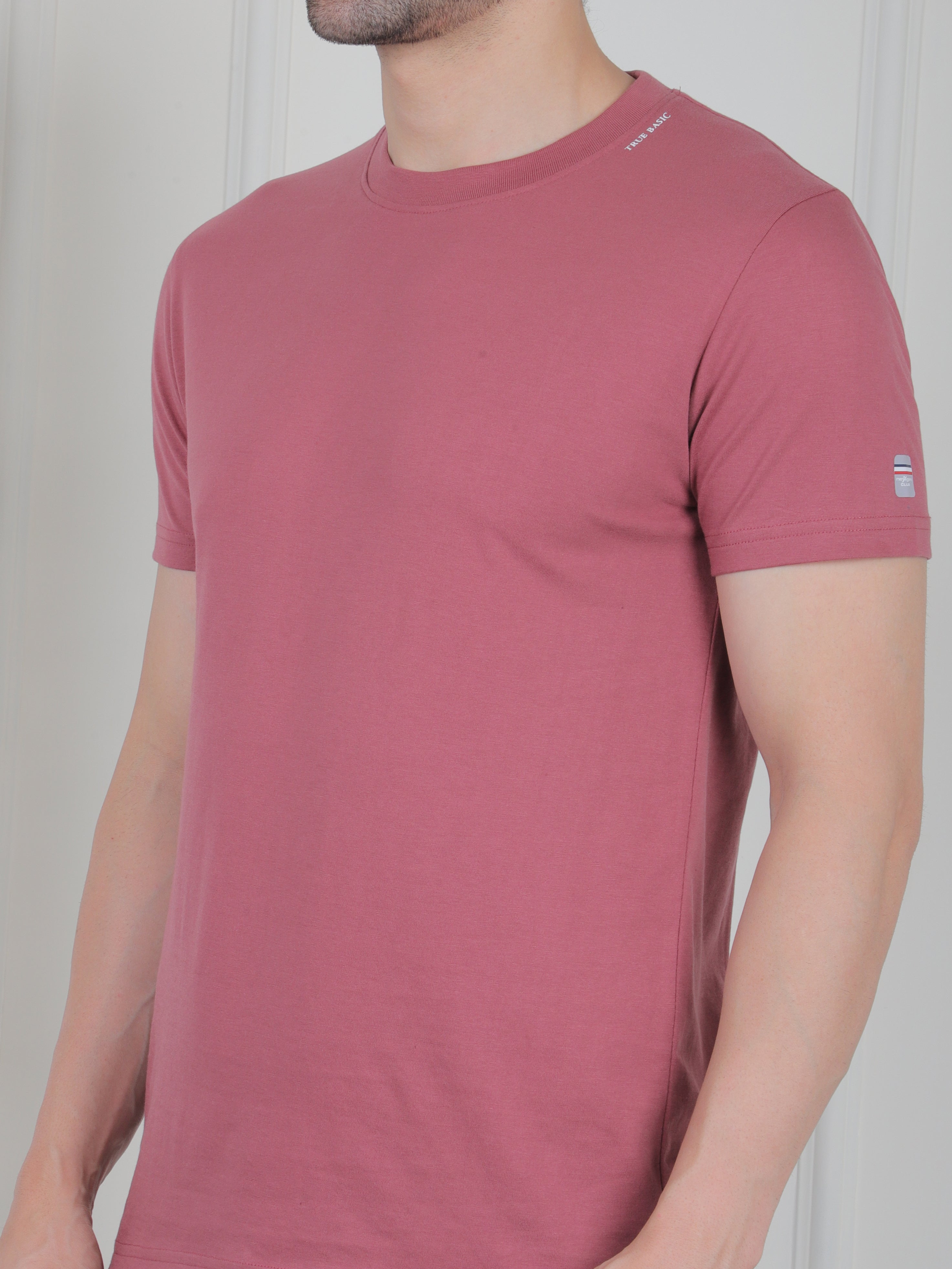 man wearing a pink everyday basic tshirt