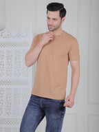 man wearing a beige everyday basic tshirt