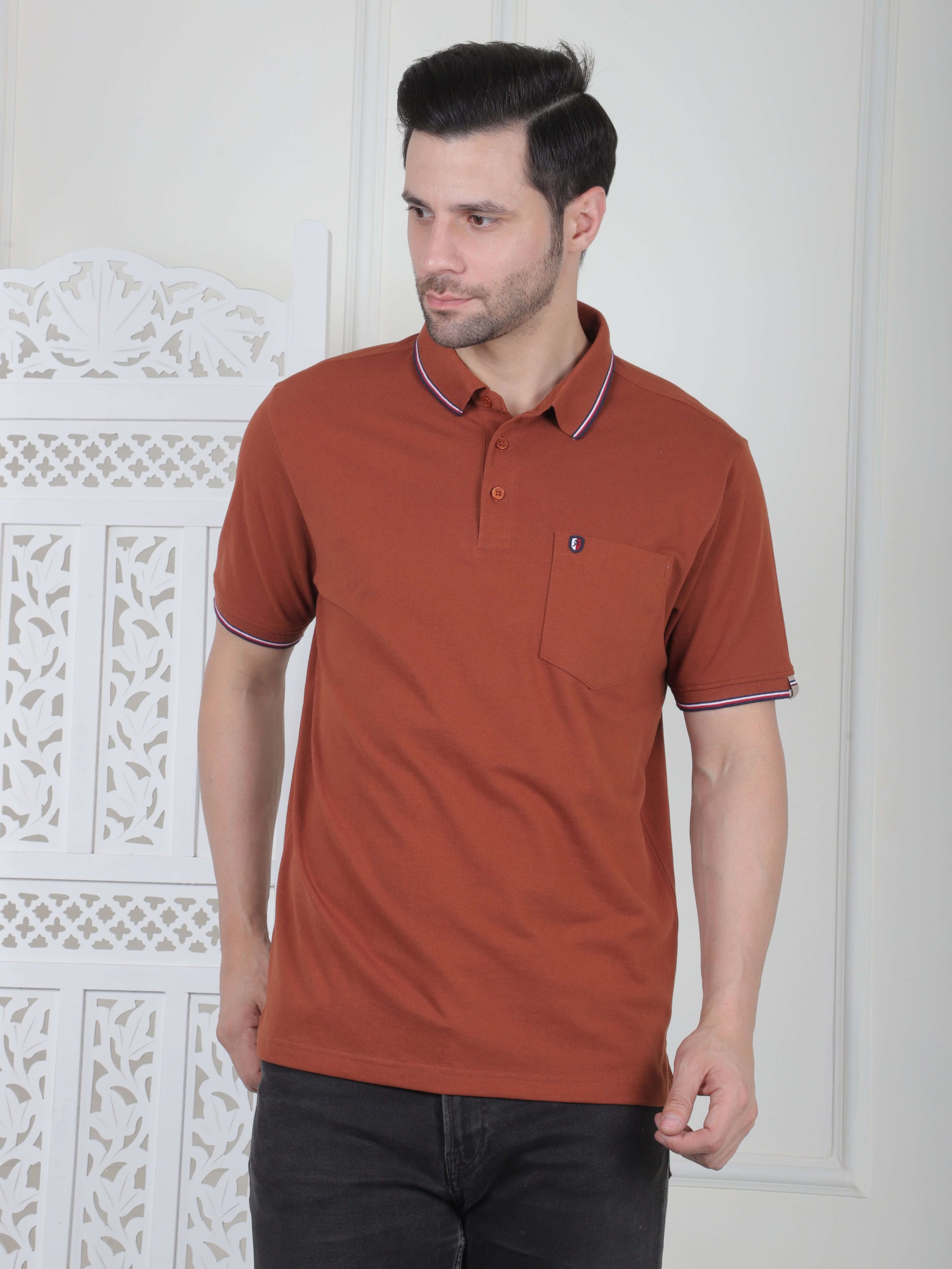 A rust brown polo shirt with pocket and piping details