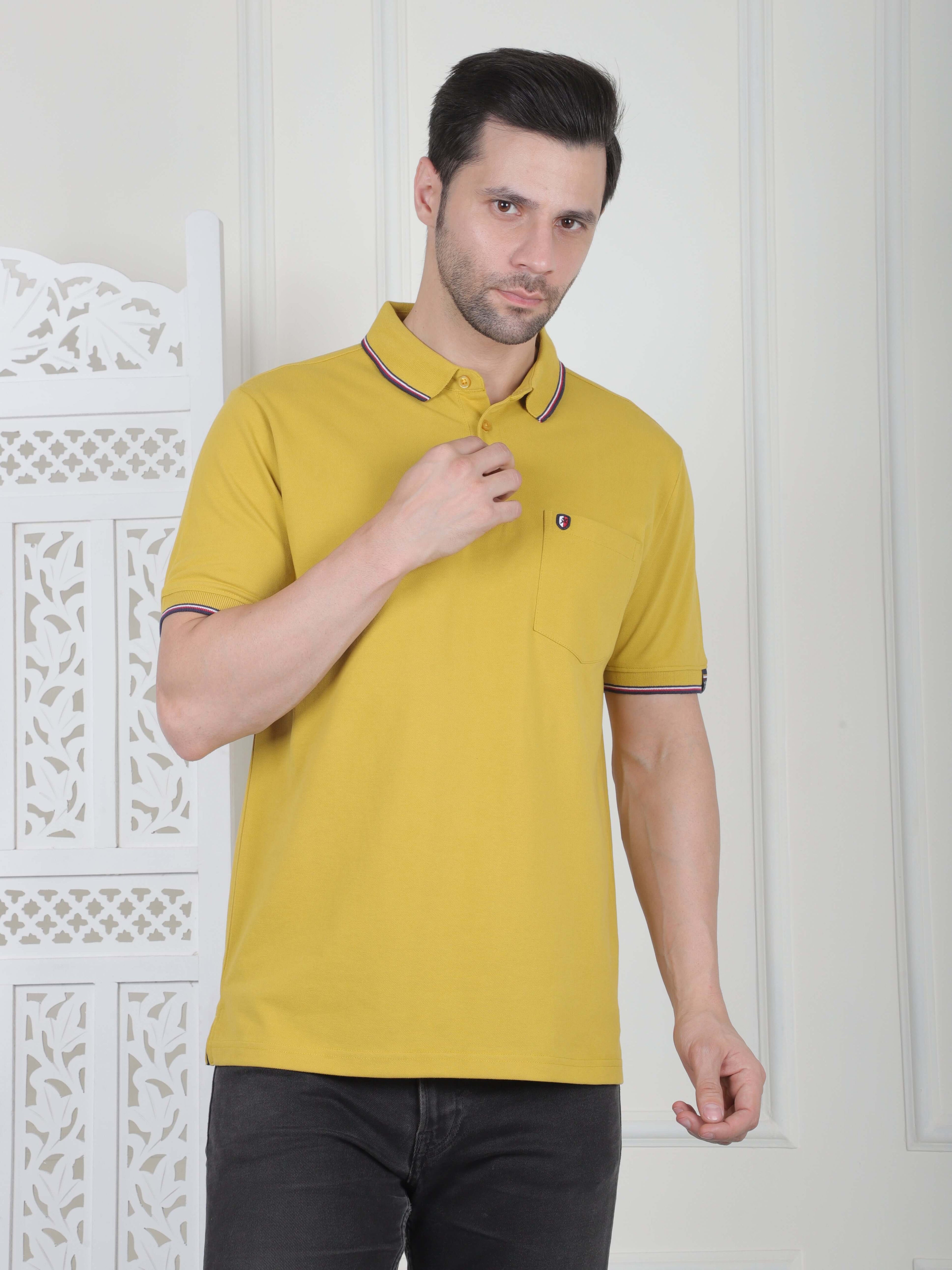 A mustard polo shirt with pocket and piping details